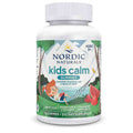 A white plastic bottle of Nordic Naturals Kids Calm Gummies, featuring a colorful label with illustrations of a child, trees, mountains, and watermelon slices.