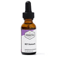 Bottle of 'RET Stomach' homeopathic remedy with a dropper on a white background