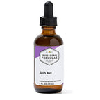 Bottle of Skin Aid with a dropper labeled 'Professional Formulas' on a white background