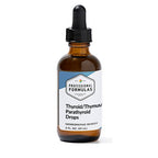 Bottle of Thyroid/Thymus/Parathyroid Drops with a dropper on a white background