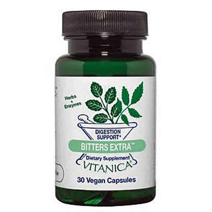 A dark green glass bottle of Vitanica Bitters Extra dietary supplement with a black ribbed cap and a white label featuring green leaf graphics.