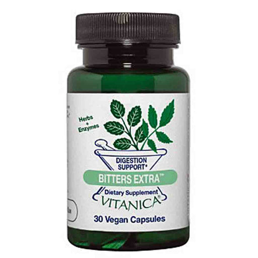 A dark green glass bottle of Vitanica Bitters Extra dietary supplement with a black ribbed cap and a white label featuring green leaf graphics.