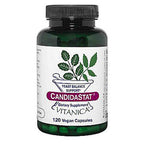 A bottle of Candidastat dietary supplement by Vitanica, containing 120 vegan capsules. The product is in a dark green translucent bottle with a black ribbed cap and a white label featuring green leaf illustrations and a purple brand banner.