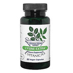 A dark green bottle of Vitanica Lysine Extra dietary supplement with a white label and green leaf graphic, on a plain white background.
