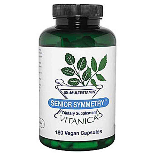 A bottle of Vitanica Senior Symmetry 65+ Multivitamin dietary supplement, featuring a dark green translucent bottle, black cap, and a white label with green leaf graphics and blue accents.