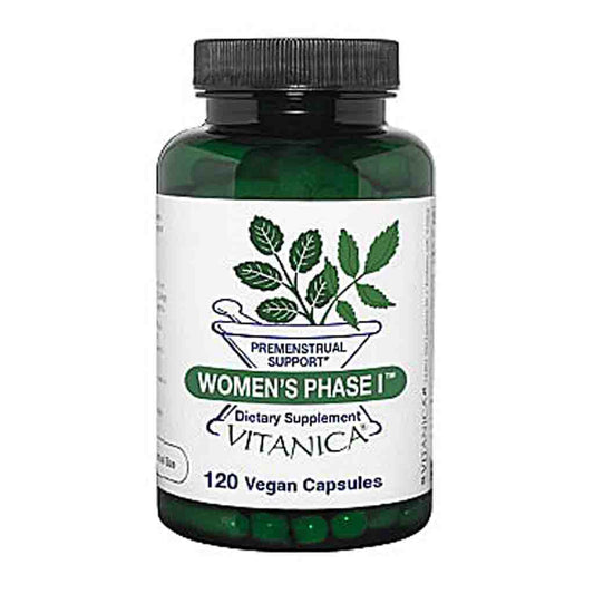A bottle of Vitanica Women's Phase I dietary supplement capsules, featuring a dark green translucent bottle, black cap, and a white label with green and black text and botanical graphics.
