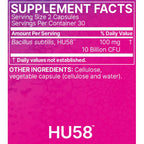 A close-up of a supplement facts label with a bright pink background and white text. The label shows 'SUPPLEMENT FACTS' at the top, a serving size of 2 capsules, and Bacillus subtilis, HU58 at 100 mg (10 Billion CFU).