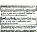 A close-up of a black label with white text detailing product instructions, warning, supplement facts, and ingredients for Vitamin D-3 and K-2 emulsion.