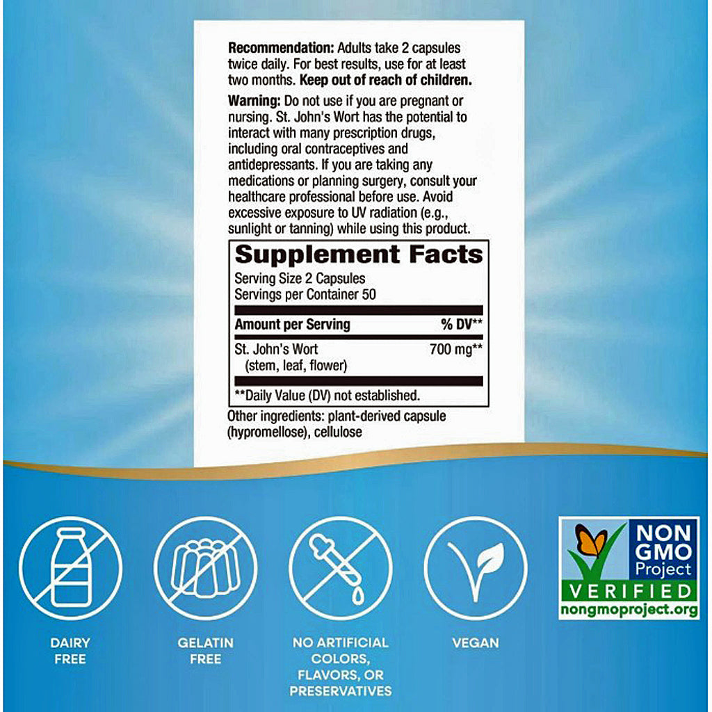 Back of a St. John's Wort dietary supplement box showing usage recommendation, warning, and supplement facts on a white label over a blue background with icons for dairy free, gelatin free, no artificial colors, and vegan, plus a Non-GMO Project Verified logo.