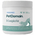 A white plastic tub of PetDomain B ComplexVet dog supplements with a white ribbed cap, featuring a label with teal and dark green text and graphics of a dog and cat.