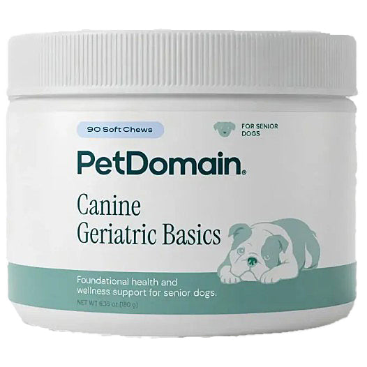 A white plastic jar of PetDomain Canine Geriatric Basics soft chews for senior dogs, featuring a teal and white label with a puppy illustration.