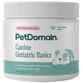 A white plastic jar of PetDomain Canine Geriatric Basics for senior dogs, featuring a white ribbed lid and a label with teal and pink accents.