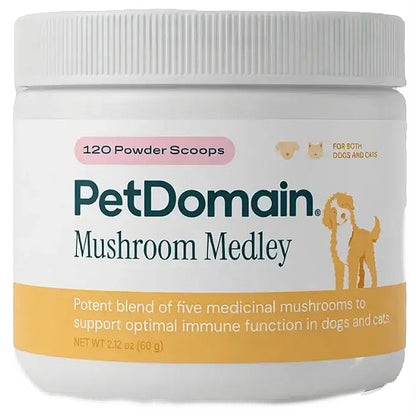A white plastic jar of PetDomain Mushroom Medley for dogs and cats, containing 120 powder scoops. The label features the brand name in dark teal, a pink badge, and an orange-yellow band at the bottom with a cartoon dog illustration.