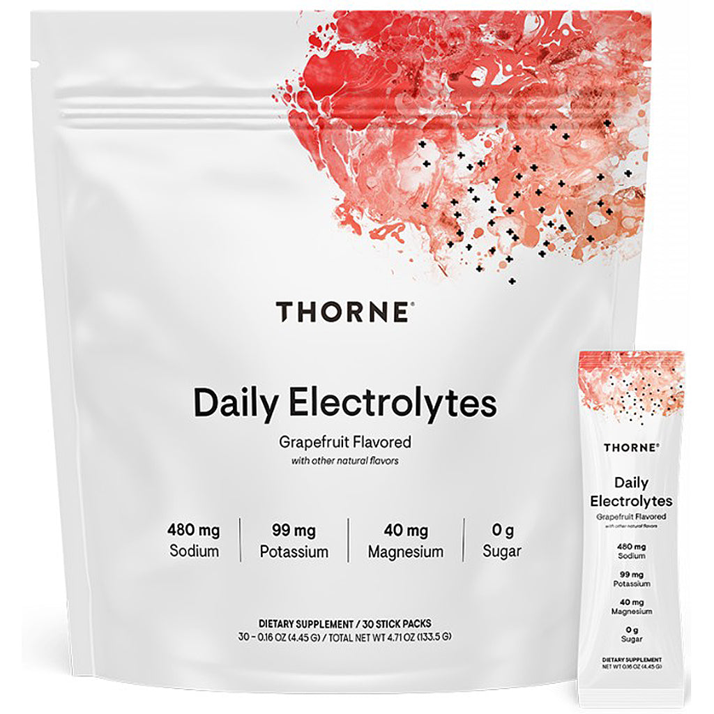 A white stand-up pouch of Thorne Daily Electrolytes grapefruit flavored dietary supplement, shown with a smaller matching single-serve stick pack beside it on a white background.