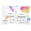 Two Thorne supplement packages, one labeled 'Amino Complex' and the other 'Daily Electrolytes', on a white background.