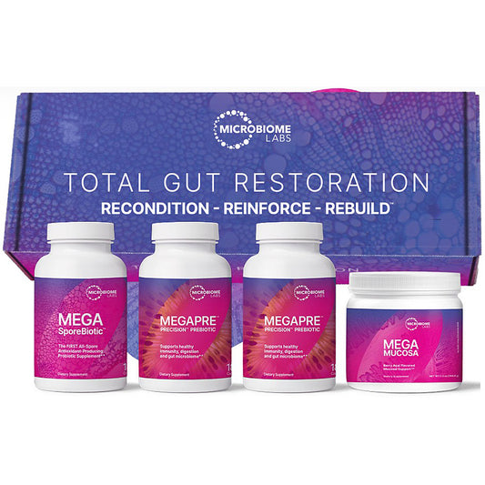 Microbiome Labs Total Gut Restoration gift set featuring three supplement bottles and one jar in front of a branded purple box.